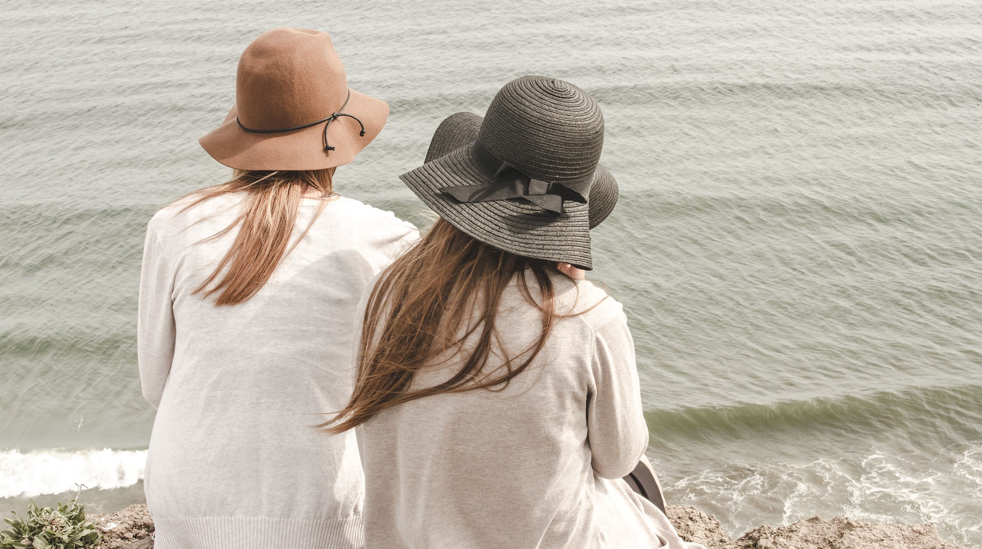 2 young women on a beach