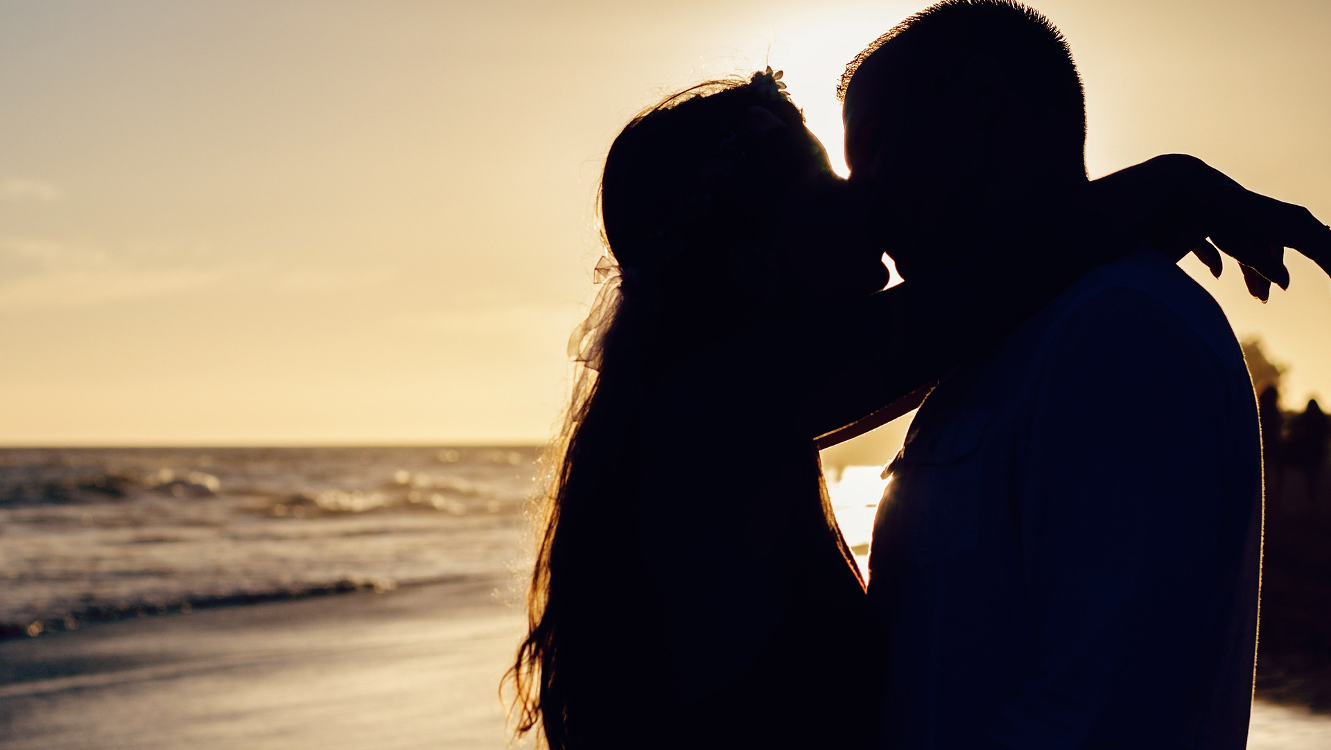 Couple kissing on the beach