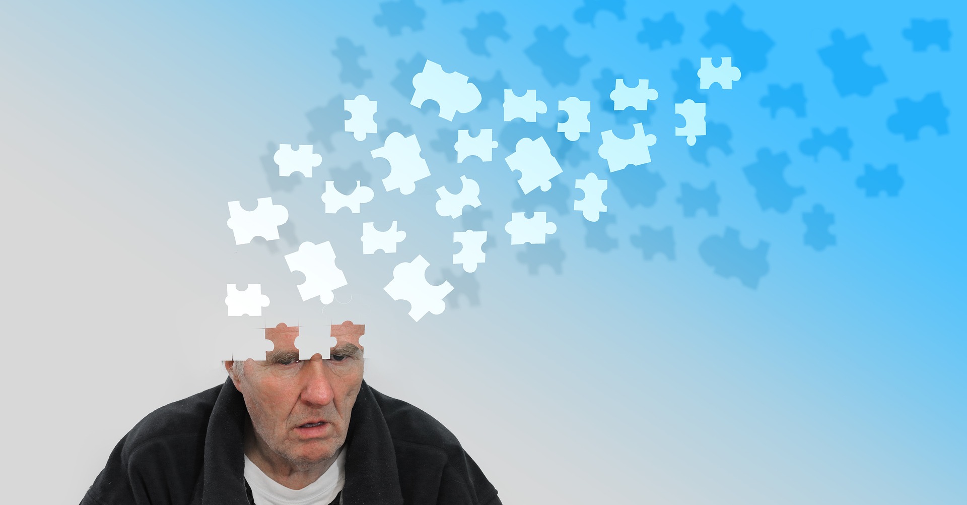 Image of man with puzzle peices flying from head signifying dementia