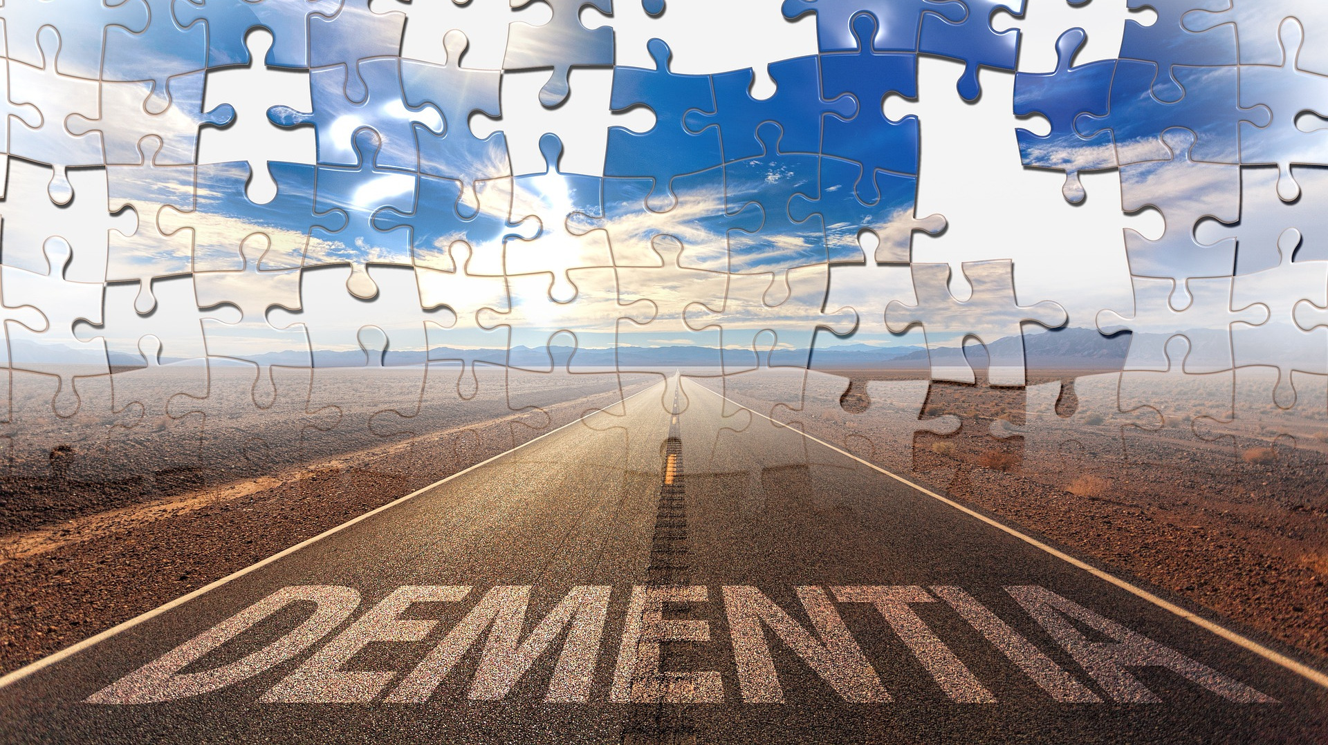 Road with puzzle pieces and word dementia