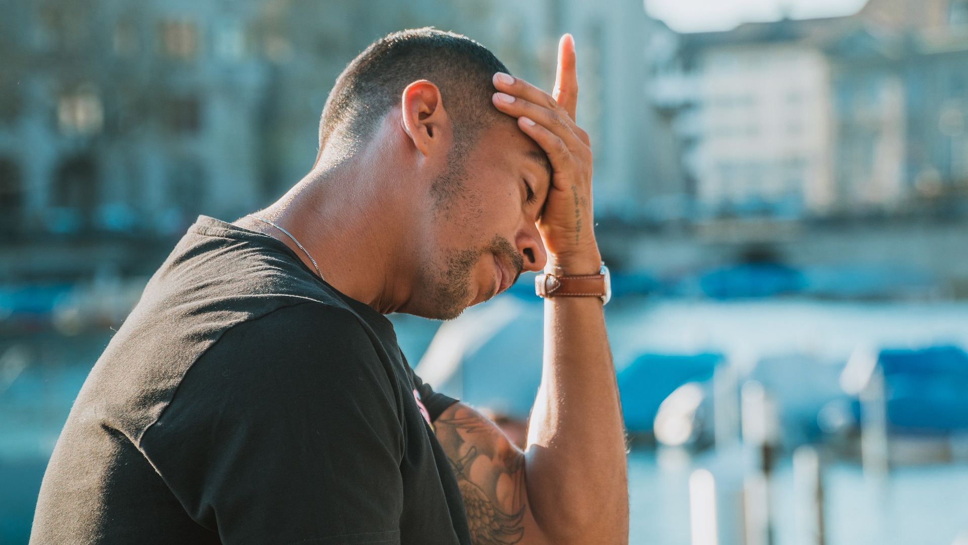 Man holding his head with a headache