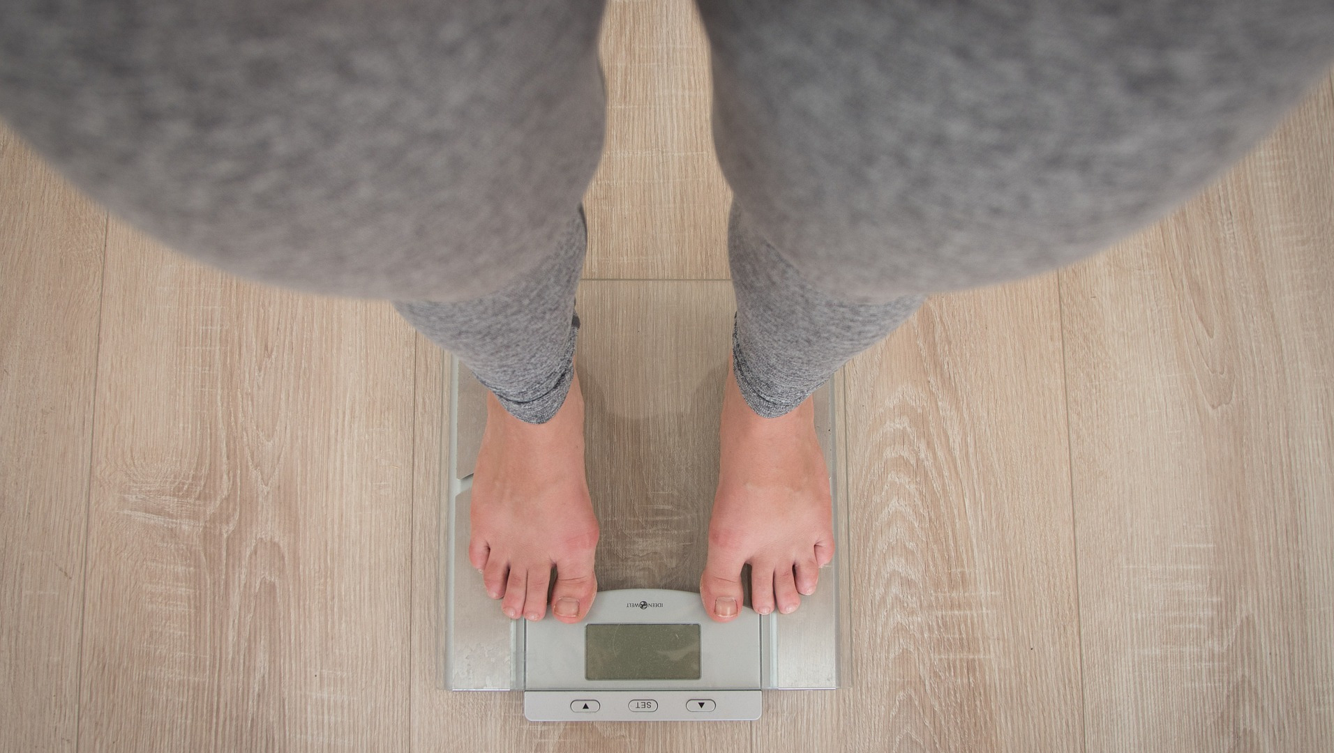 woman standing on scale