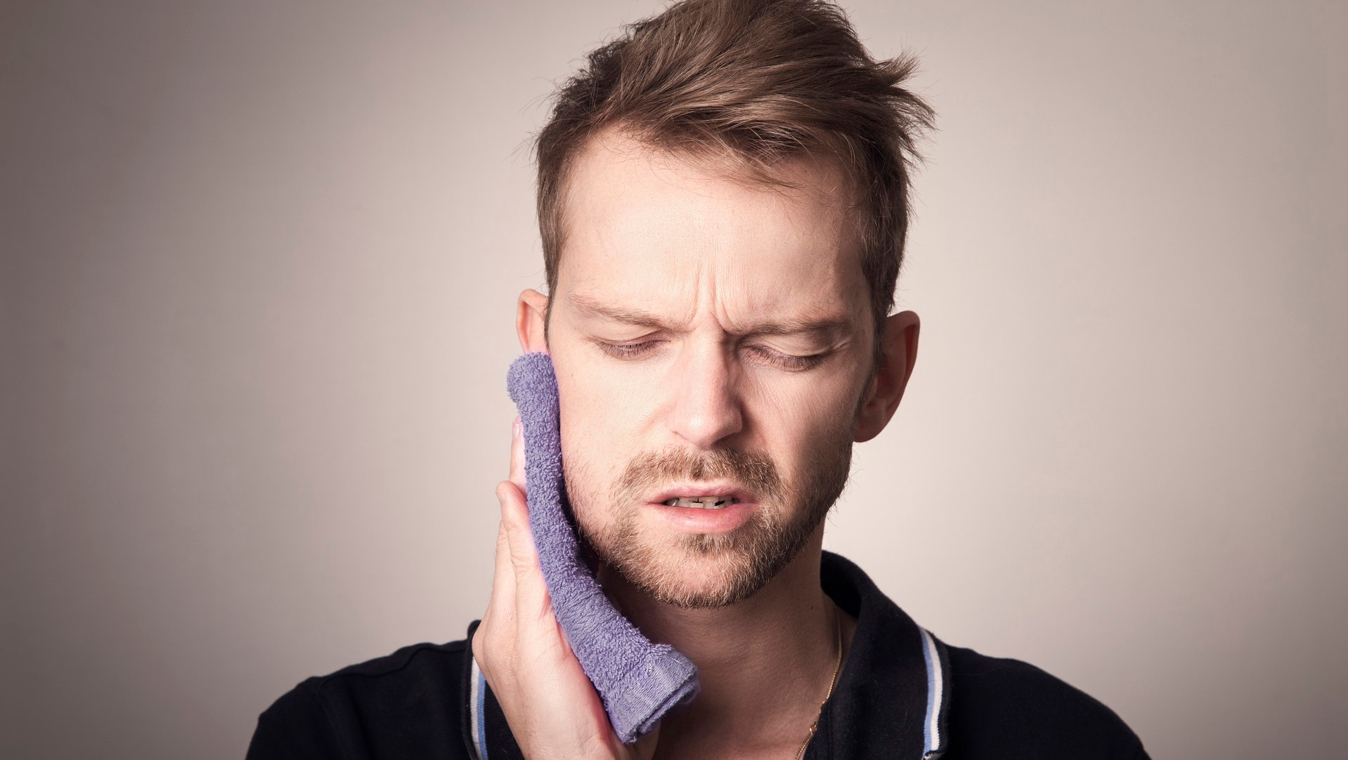 Man holding his jaw