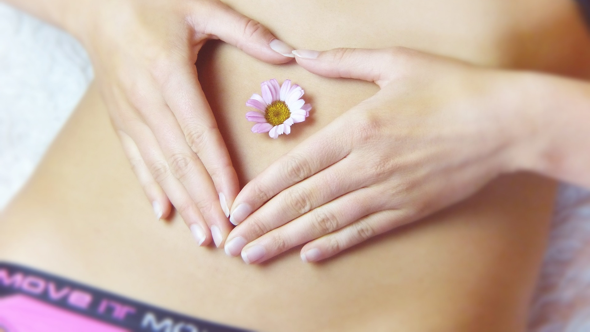 Woman with hands on her stomach